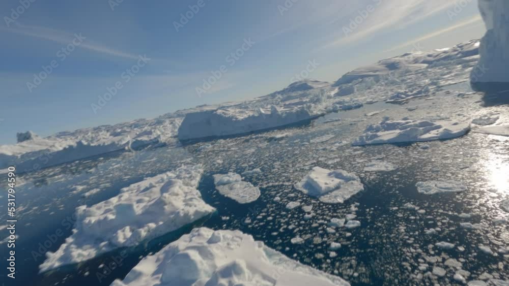 Ice And Calm Sea Surface Reflecting Bright Sunlight Ice And Calm Sea Surface Reflecting Bright Sunlight