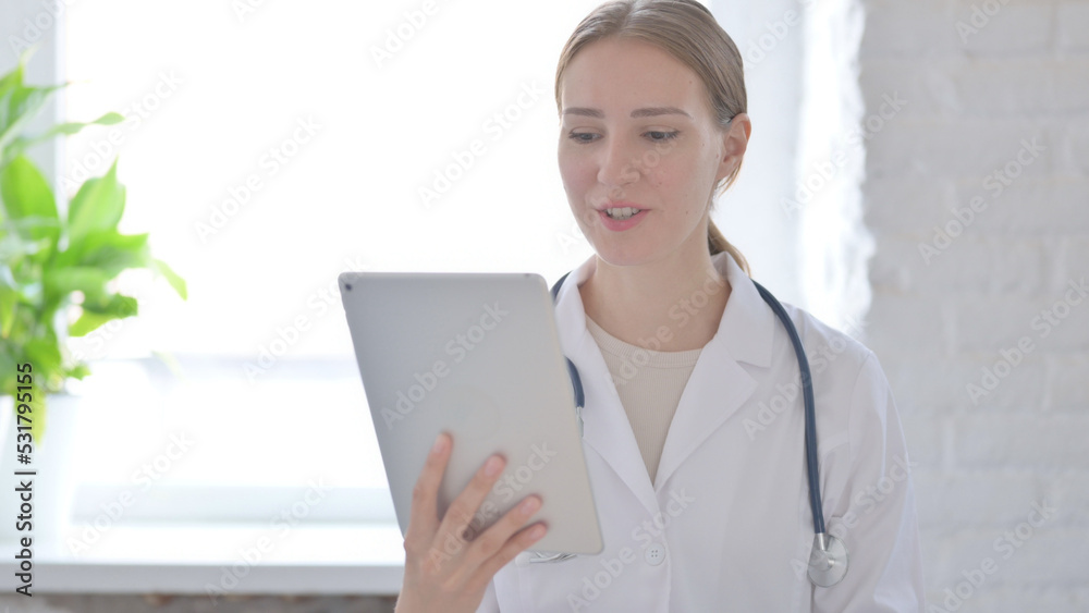Lady Doctor Talking for Online Video Call on Tablet Lady Doctor Talking for Online Video Call on Tablet