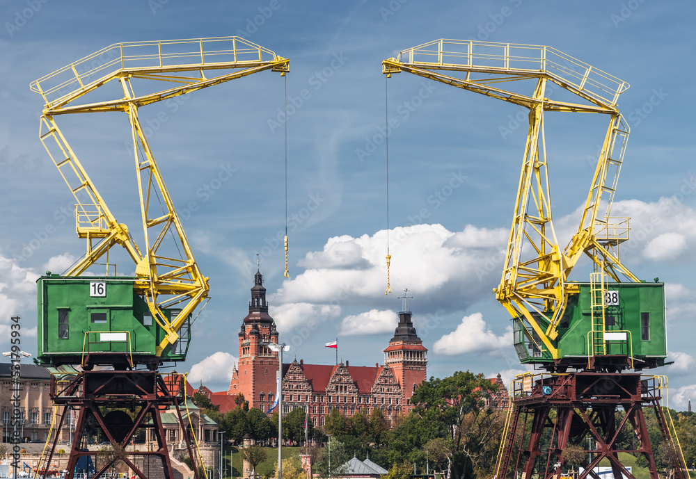 Old port cranes, one of the landmarks and symbols of the city; Wały Chrobrego in the background. Szczecin, Zachodniopomorskie, Poland.