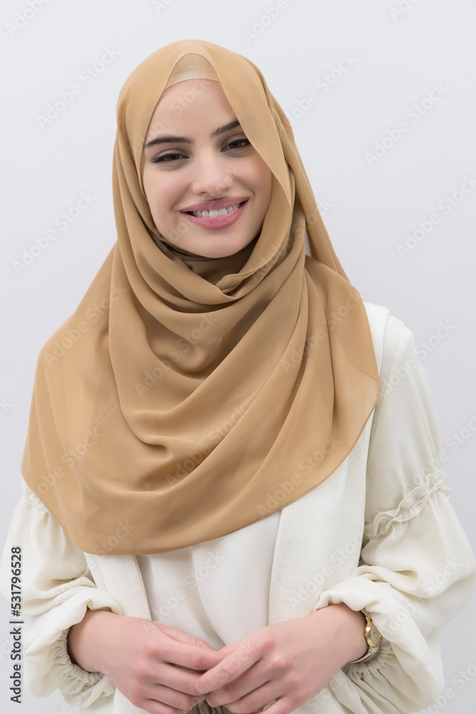 Portrait of young muslim woman wearing hijab on isolated white background Portrait of young muslim woman wearing hijab on isolated white background
