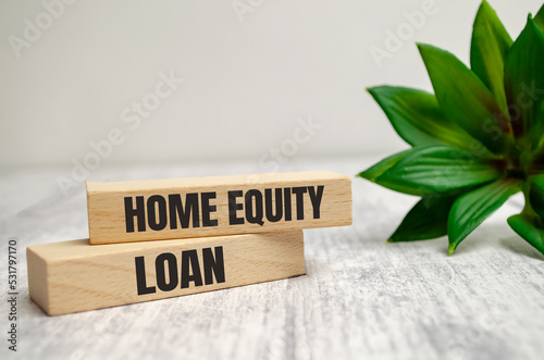 home Equity loan Word Written In Wooden Cube and hand