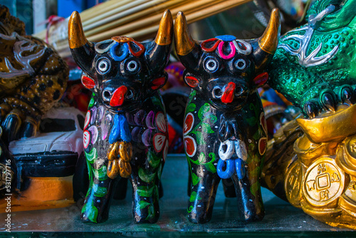 Colourful Pucara bulls in the market of San Pedro, Cusco, Peru.  photo