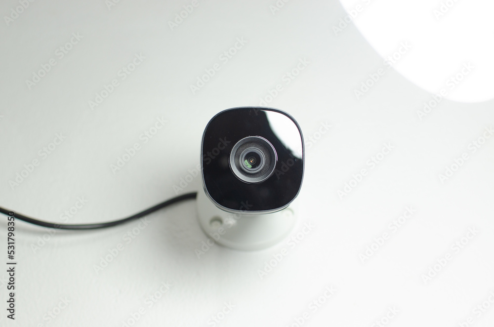 CCTV videocam, CFTV security camera, white camera with secure circuit, theft protection. Surveillance view. CCTV videocam, CFTV security camera, white camera with secure circuit, theft protection. Surveillance view.