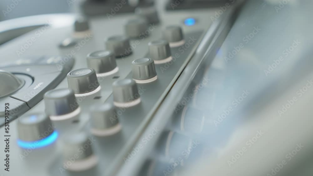 Doctor Hand on Buttons of Modern Ultrasound Echocardiography Machine Doctor Hand on Buttons of Modern Ultrasound Echocardiography Machine