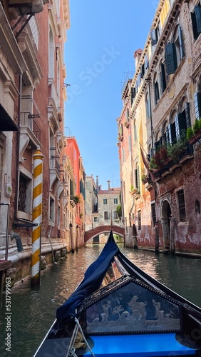 Beautiful view of a small canal in Venice with gondolas