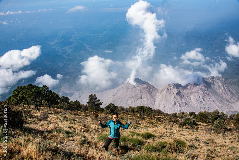 Hiker at Santiaguito lava dome erupting off Santa Maria volcano, Quetzaltenango, Guatemala