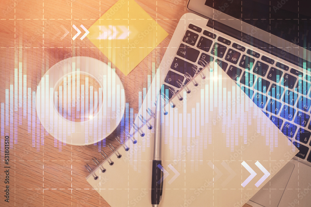 Double exposure of forex chart drawing over table background with computer. Concept of financial research and analysis. Top view. Double exposure of forex chart drawing over table background with computer. Concept of financial research and analysis. Top view.