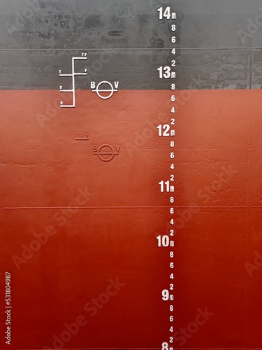 A mid draft mark, load line and plimsoll mark on a side of cargo ship or bulk carrier photo