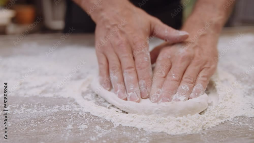 Man Making Pizza Dough On Table Outdoors Man Making Pizza Dough On Table Outdoors