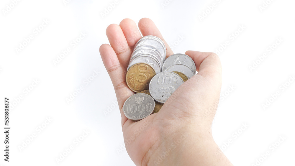 Close up Indonesian Coins in hands. Selective Focus Close up Indonesian Coins in hands. Selective Focus