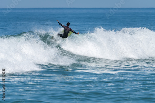 Surfer riding waves
