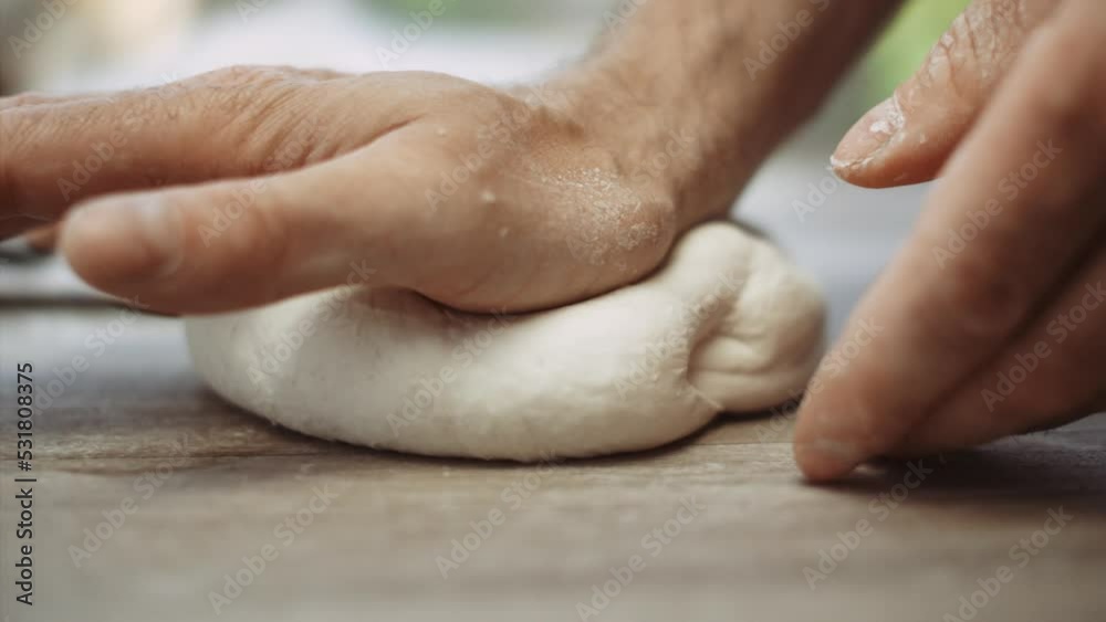 Man Kneading Pizza Dough On Table Man Kneading Pizza Dough On Table