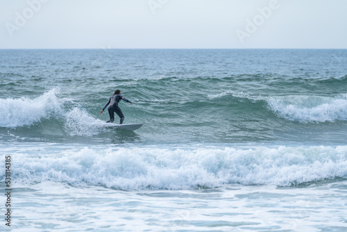 Surfer girl riding a wave