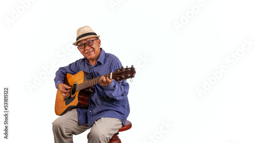 Studio portrait of senior man with hat playing guitar on white  background and space for character

