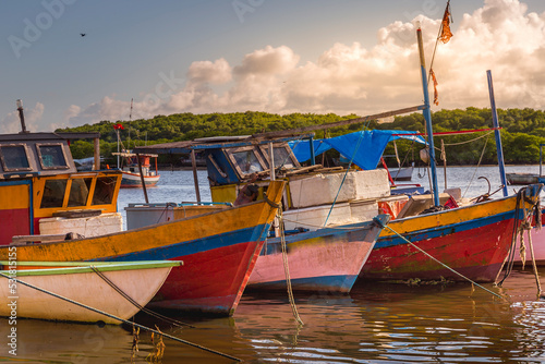 Bay at sunset with fishing trawler rustic boats in Porto Seguro, BAHIA, Brazil © Aide