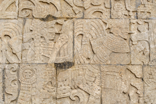 Stone carvings along the walls of the Main Ball Court in Chichen Itza