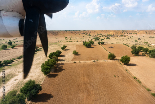 View of Thar desert from an aeroplane, Rajasthan, India. The propellers and thar desert in the frame. photo