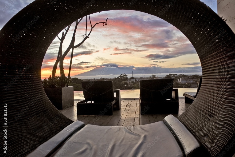 outdoor rattan chair with a view of Mount Merbabu with a circle frame of rattan chairs