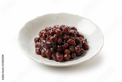 Boiled azuki beans placed on a white background. photo