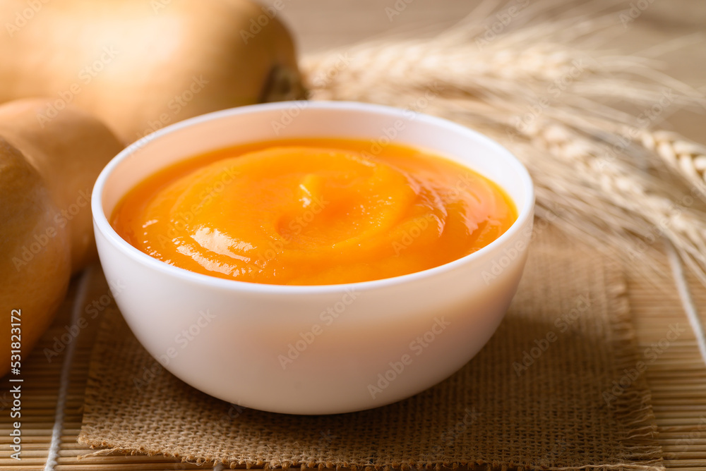 Butternut squash pumpkin soup in bowl, Homemade food in autumn season Butternut squash pumpkin soup in bowl, Homemade food in autumn season