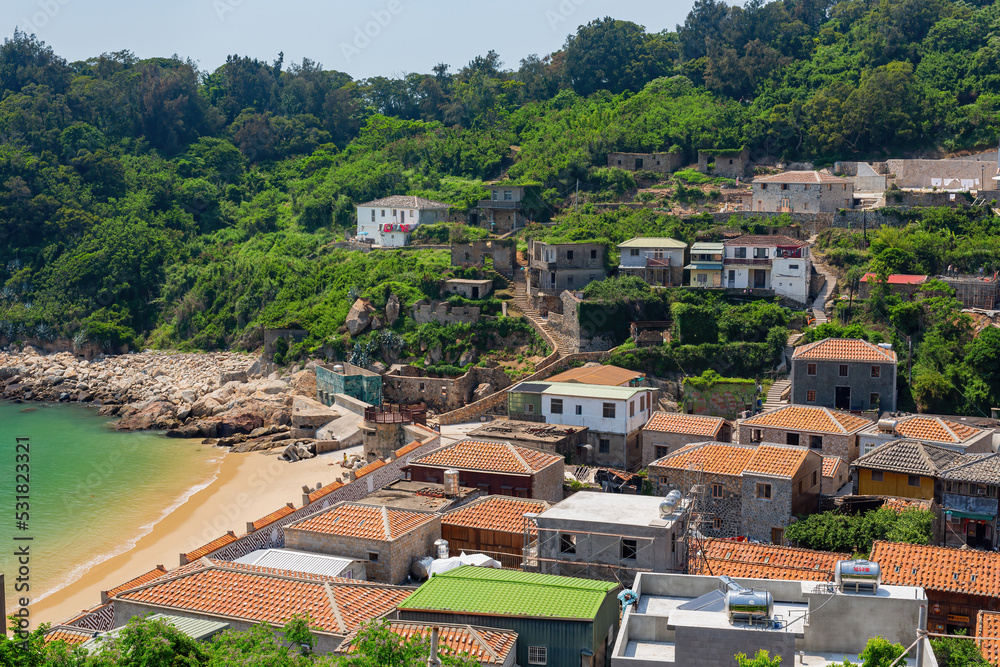 Sunny view of the Jinsha Village cityscape with beach view