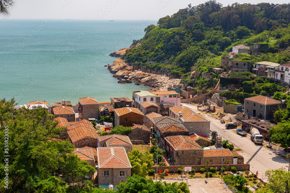 Sunny view of the Jinsha Village cityscape with beach view