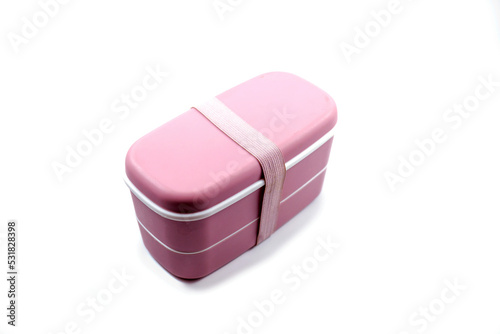 pink plastic lunch box isolated on white background.