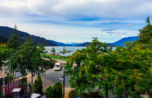 Harrison Lake at Harrison Hot Springs, BC, late summer, with alpine mountain backdrop. photo