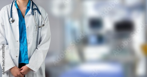 Female doctor wearing a lab coat and stethoscope working in a hospital