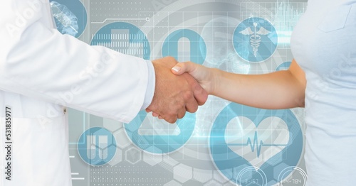 Digital illustration of a doctor and a patient shaking hands over medical icons during coronavirus c