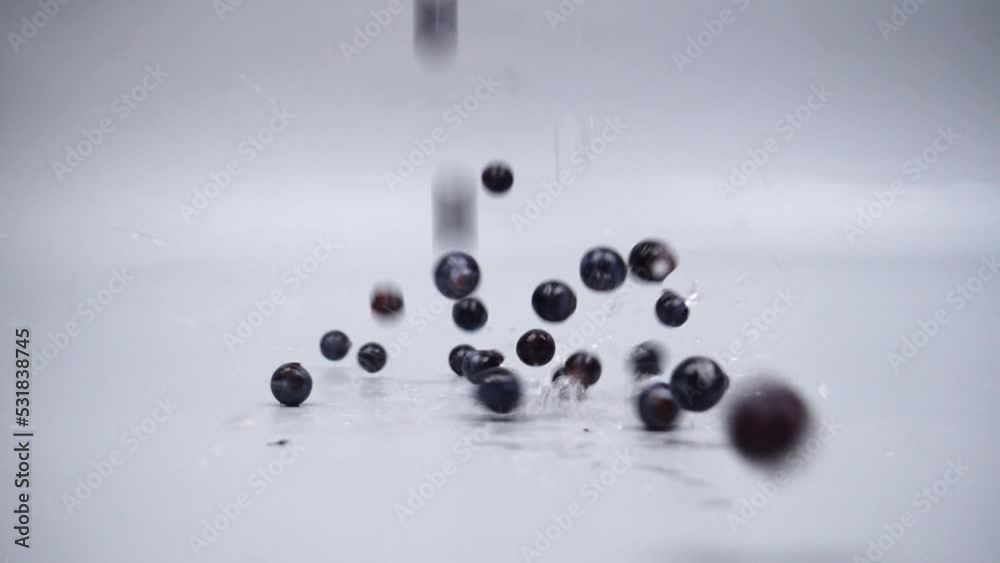 falling fresh grapes on gray background. High quality FullHD footage