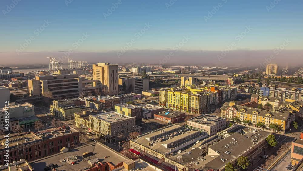 The Port of San Francisco with low elevation fog over the bay - time lapse from a drone or high vantage point The Port of San Francisco with low elevation fog over the bay - time lapse from a drone or high vantage point