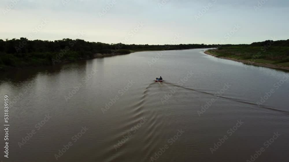 Stunning Overtake Shot Of Fisherman Sailing In Calm Water, Tebicuary River, Paraguay Stunning Overtake Shot Of Fisherman Sailing In Calm Water, Tebicuary River, Paraguay