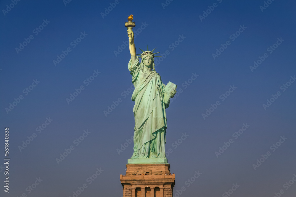 Fototapeta premium Statue of Liberty and clear sky at sunset, New York City, United States