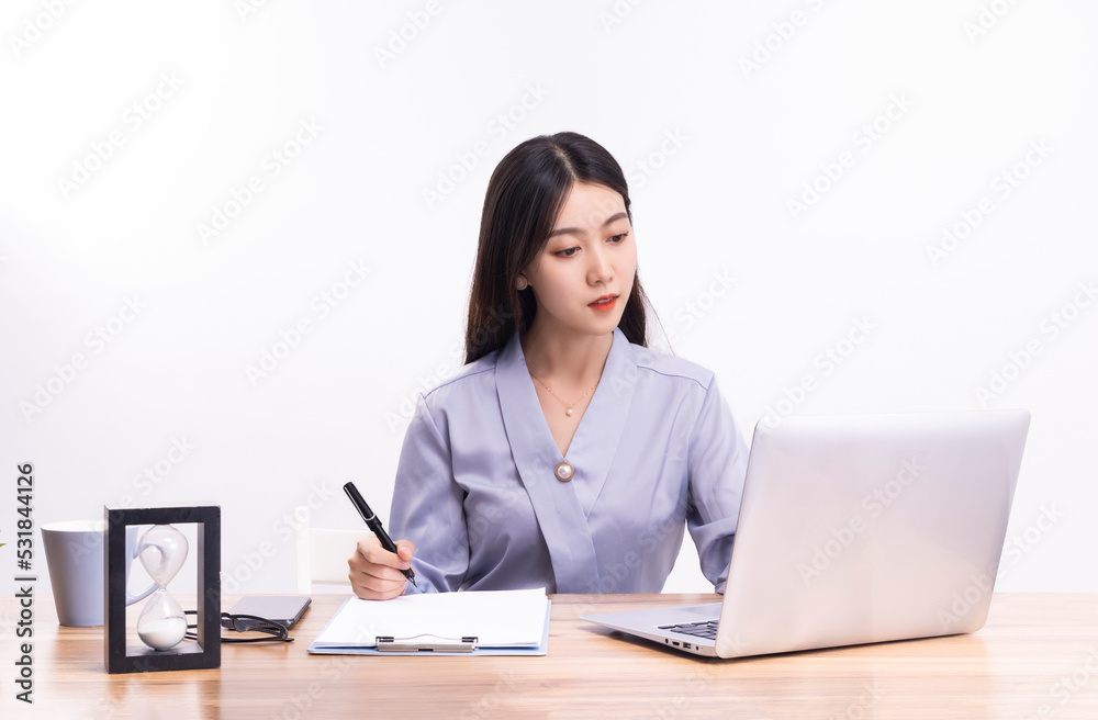 Business women who sit at their desks Business women who sit at their desks