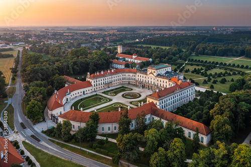 Fertod, Hungary - Aerial view of the beautiful Esterhazy Castle (Esterhazy-kastely) and garden in the Town of Fertod, near Sopron on a sunny summer morning with golden sky at sunrise