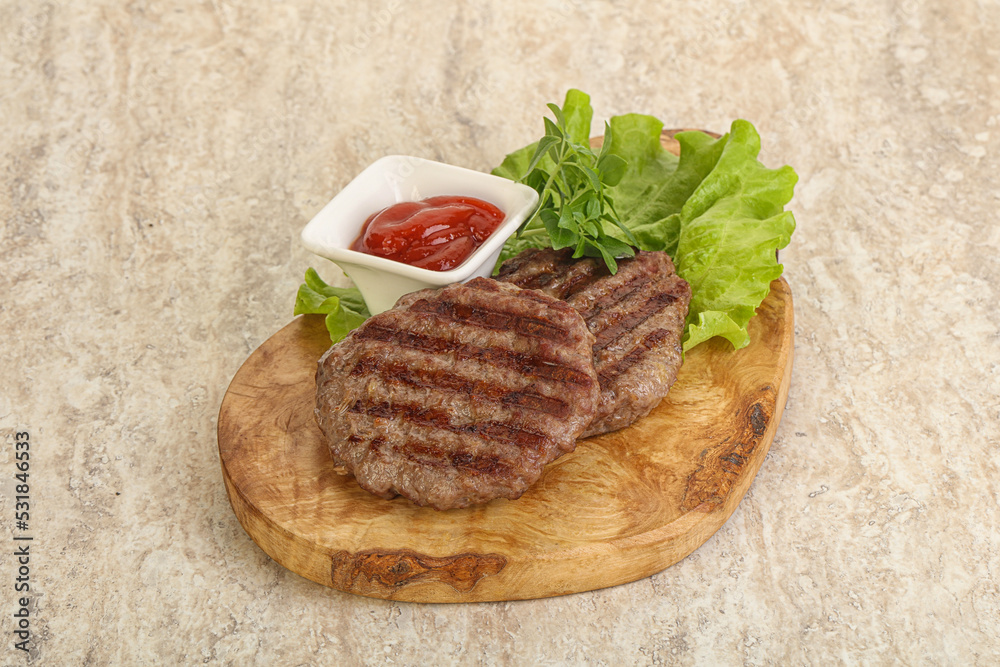 Grilled beef burger cutlet with sauce Grilled beef burger cutlet with sauce