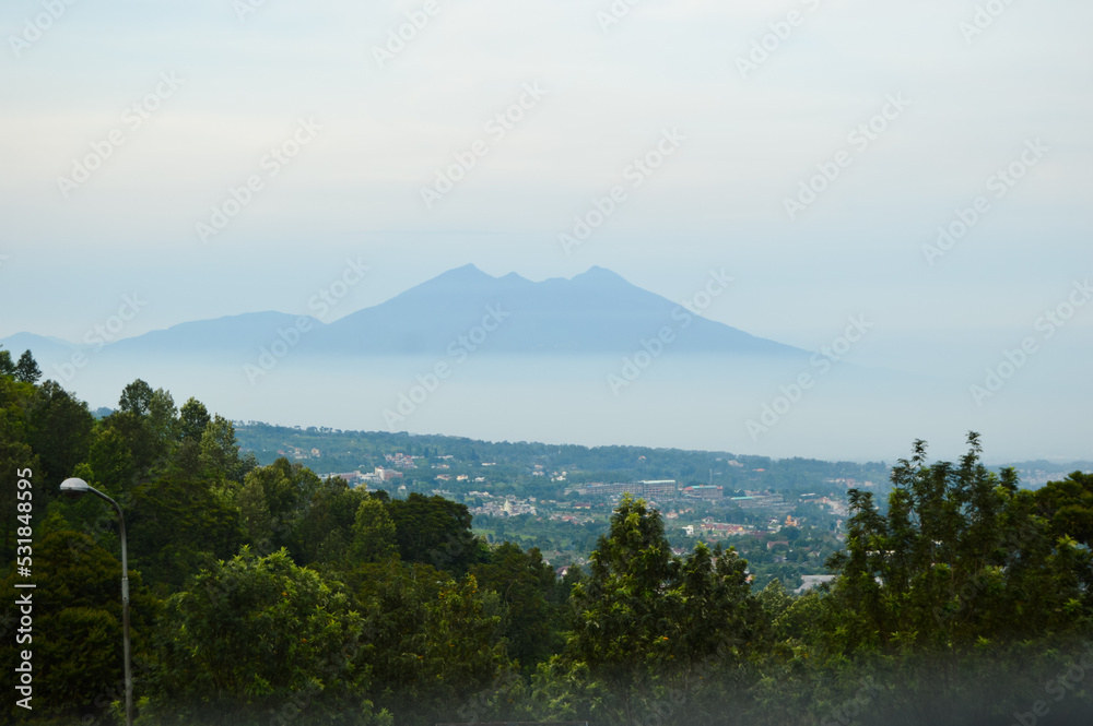 Puncak Pass, Bogor, Indonesia – Novemer 22, 2020, With Blured Background, Light Bokeh Background. Puncak Pass, Bogor, Indonesia – Novemer 22, 2020, With Blured Background, Light Bokeh Background.