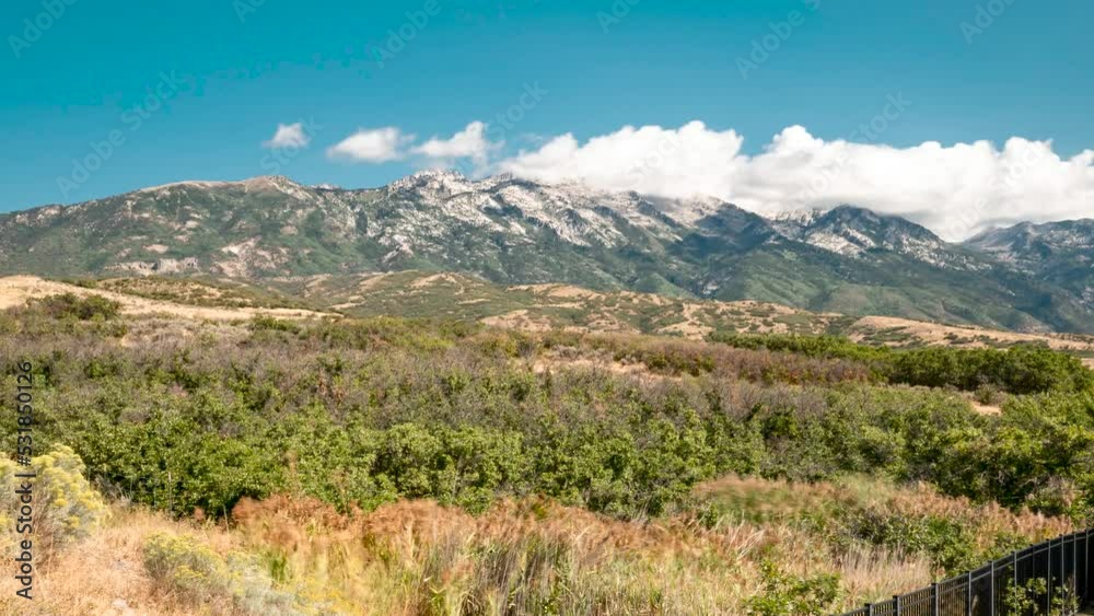 A billowing cloudscape over the Rocky Mountains as seen from Highland, Utah - panoramic motion time lapse A billowing cloudscape over the Rocky Mountains as seen from Highland, Utah - panoramic motion time lapse