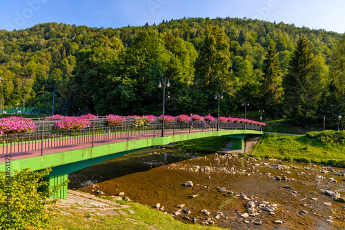 Most Michala Slowika Dzwona Bridge over Grajcarek creek in Szczawnica Zdroj springs resort in Pieniny Mountains in Lesser Poland