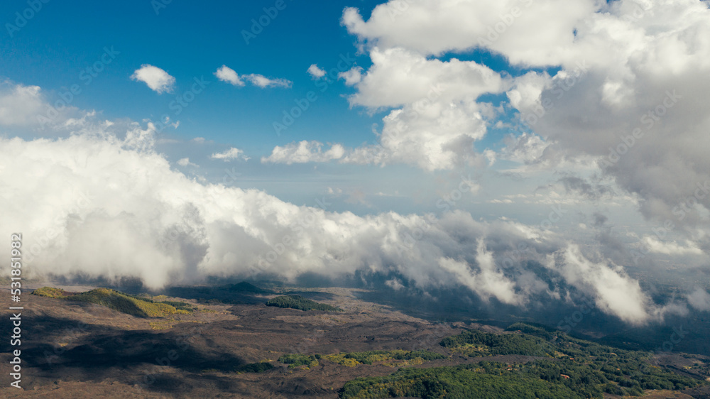 Aerial view on cloudscape and sloops of Mt. Etna, Sicily