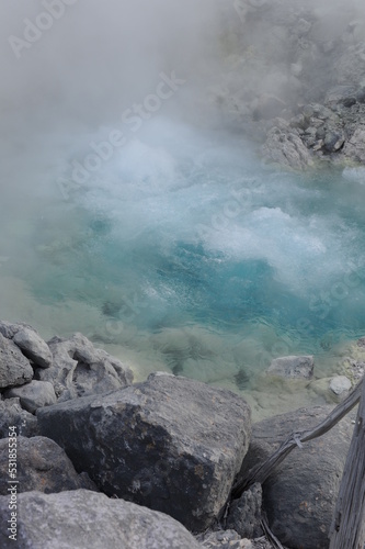Turquoise hot boiling water in geyser in mountain valley at Tamagawa Onsen Hot spring in Semboku city, Akita prefecture, Tohoku region, northern Japan, Asia