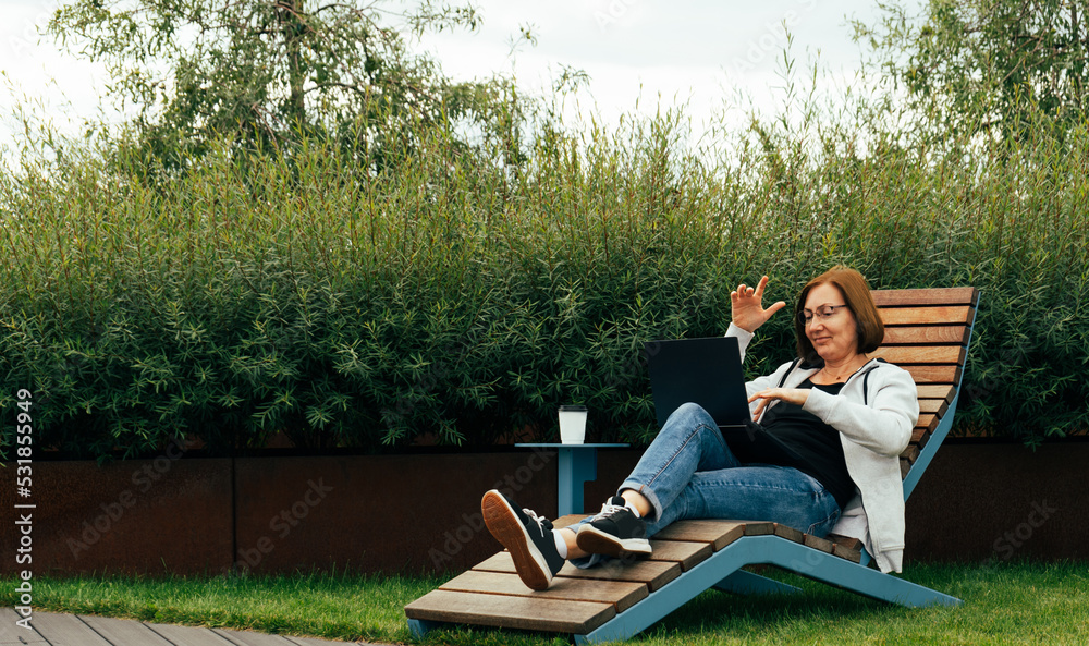Woman Working Outdoor with Laptop, Typing on Keyboard, Female Freelancer, Remote Work Concept Woman Working Outdoor with Laptop, Typing on Keyboard, Female Freelancer, Remote Work Concept