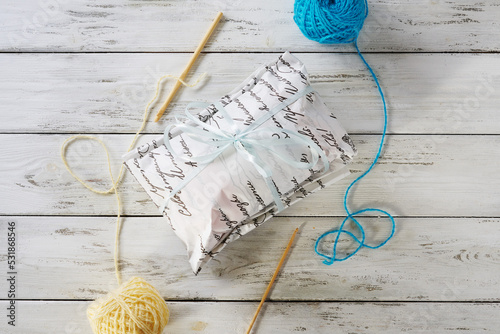 gift wrapping made of craft paper on a wooden background