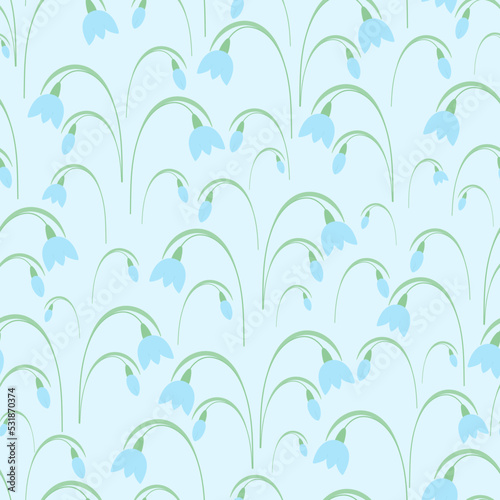 Snowdrops. Spring bouquet. Blue buds. Seamless vector pattern. Isolated blue background. Endless summer ornament of delicate plants with green leaves. Flat style. Delicate floral background. © Gebbi Mur