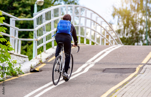 Wallpaper Mural Cyclist ride on the bike path in the city Park
 Torontodigital.ca