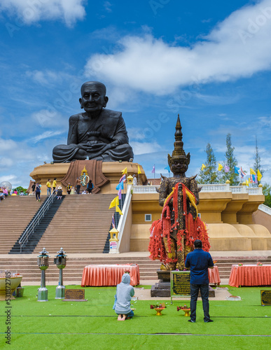 Luang Pu Thuat Wat Huay Mongkol Hua Hin Thailand,Big Buddha Wat Huay Mongkol on a sunny day photo