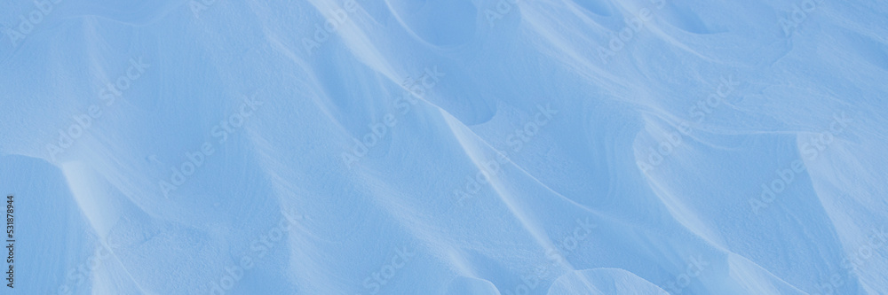 View of Snow texture. Wind sculpted patterns on snow surface. Wind in the ...