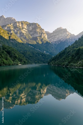 Vertical shot of a lake in Lago della Stua, Canzoi Valley, Italy photo