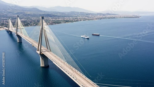 Aerial drone shot of cable strayed bridge over sea also known as Charilaos Trikoupis Rio - Antirio bridge which connects Greece mainland with Peloponnese. photo